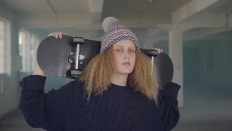 fashionable young woman in an abandoned warehouse