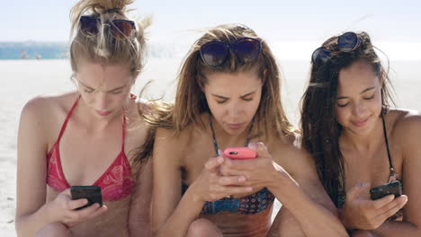 teenage girl friends disconnected using mobile phones bored of conversation