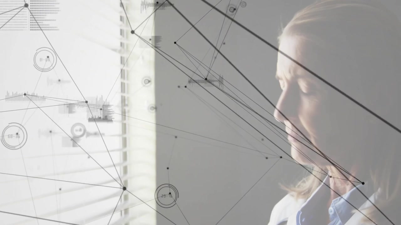 Senior doctor by blinds tapping smartphone initiating graphics linking data points, examining data
