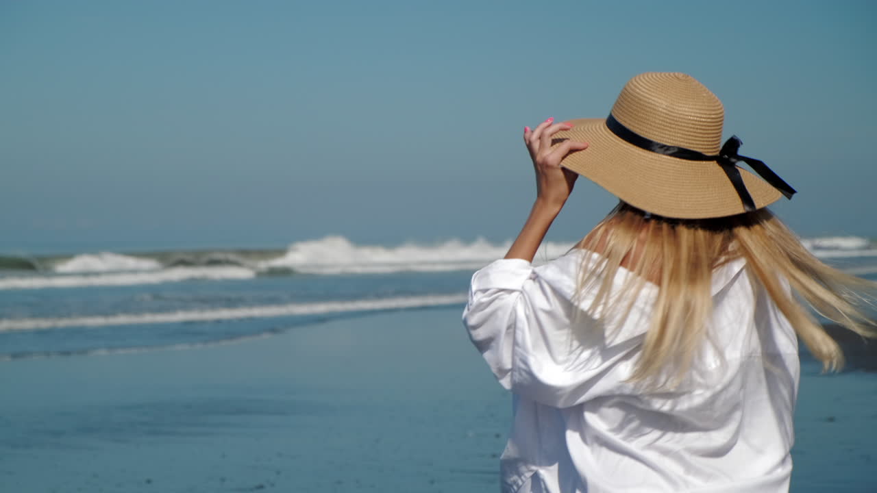 Woman at the beach enjoying the day