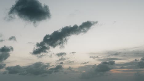 Static-timelapse-of-dissipating-clouds-from-end-of-orange-sunset-to-twilight