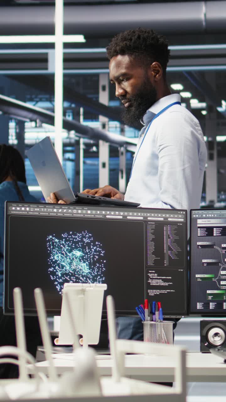 Vertical Video Happy Data Center Admin Uses Node Tree Programming On Laptop