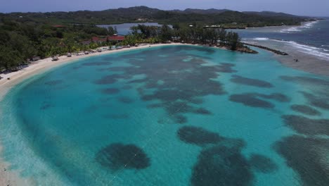 Honduras-Roatan-bay-islands-view-to-hotel-and-blue-beach-air2s-5k