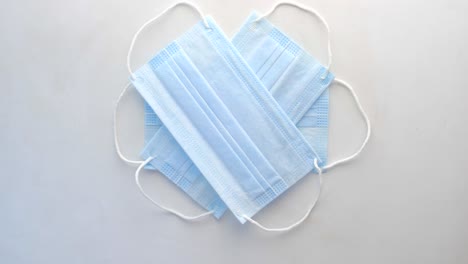 pile of blue surgical masks