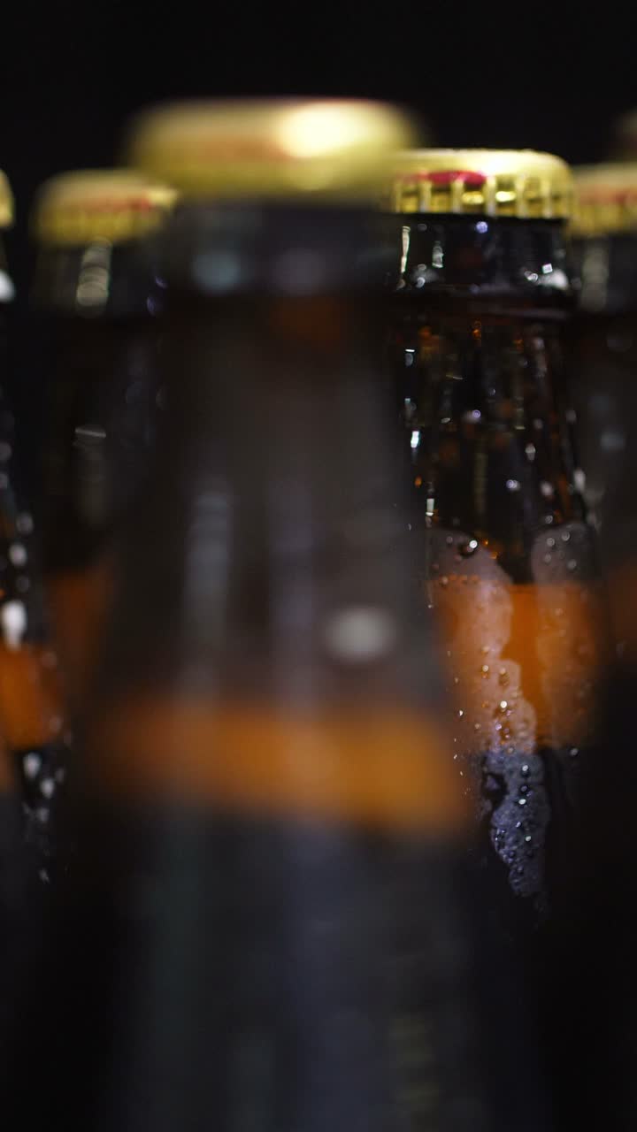 Close-up of cold beer bottles