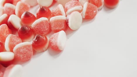 Close-up-view-of-halloween-candy-corn-fallen-against-grey-background