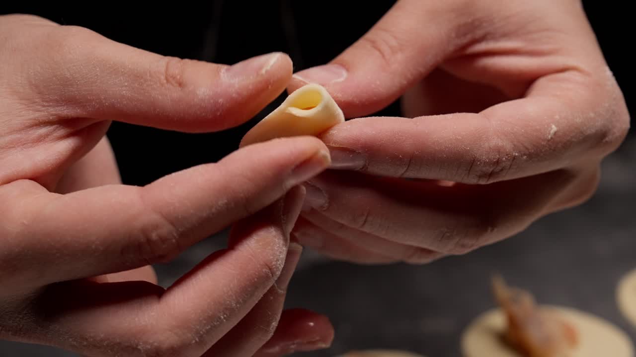 Close-up of Hands Folding a Shrimp Dumpling