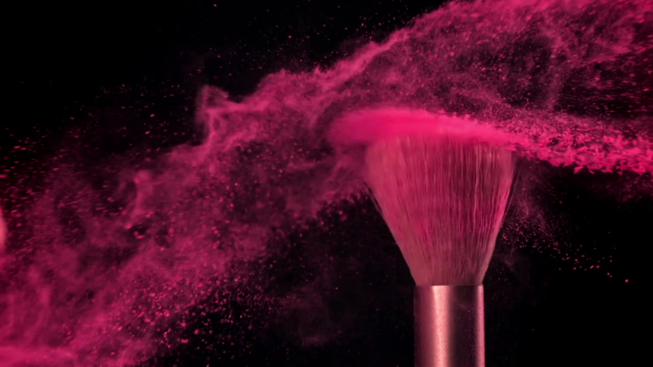 Slow Motion of Makeup Brush Striking Another, Releasing Pink Powder