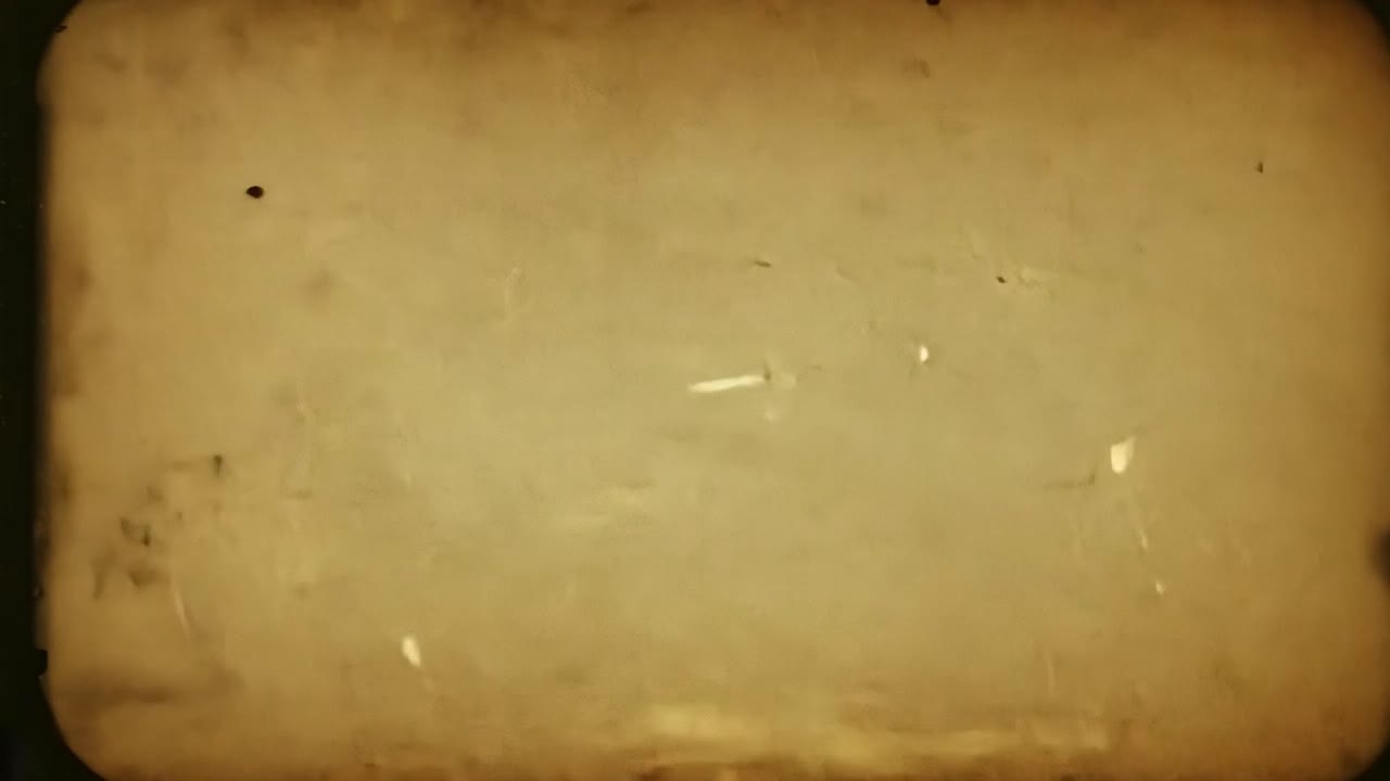 animación que muestra el efecto de quemar vieja película contra un fondo negro, creando un aspecto vintage y angustiado