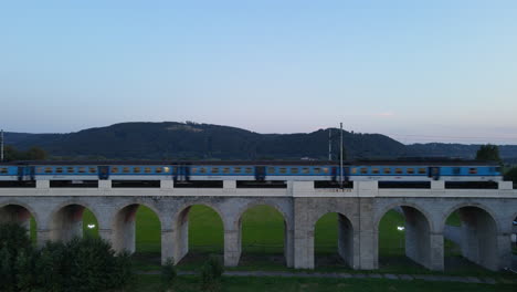 passage of a train on a railway bridge front view of the bridge