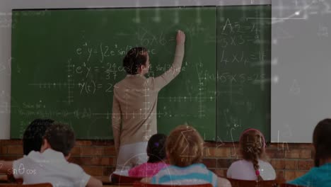 teacher writing on chalkboard 4k