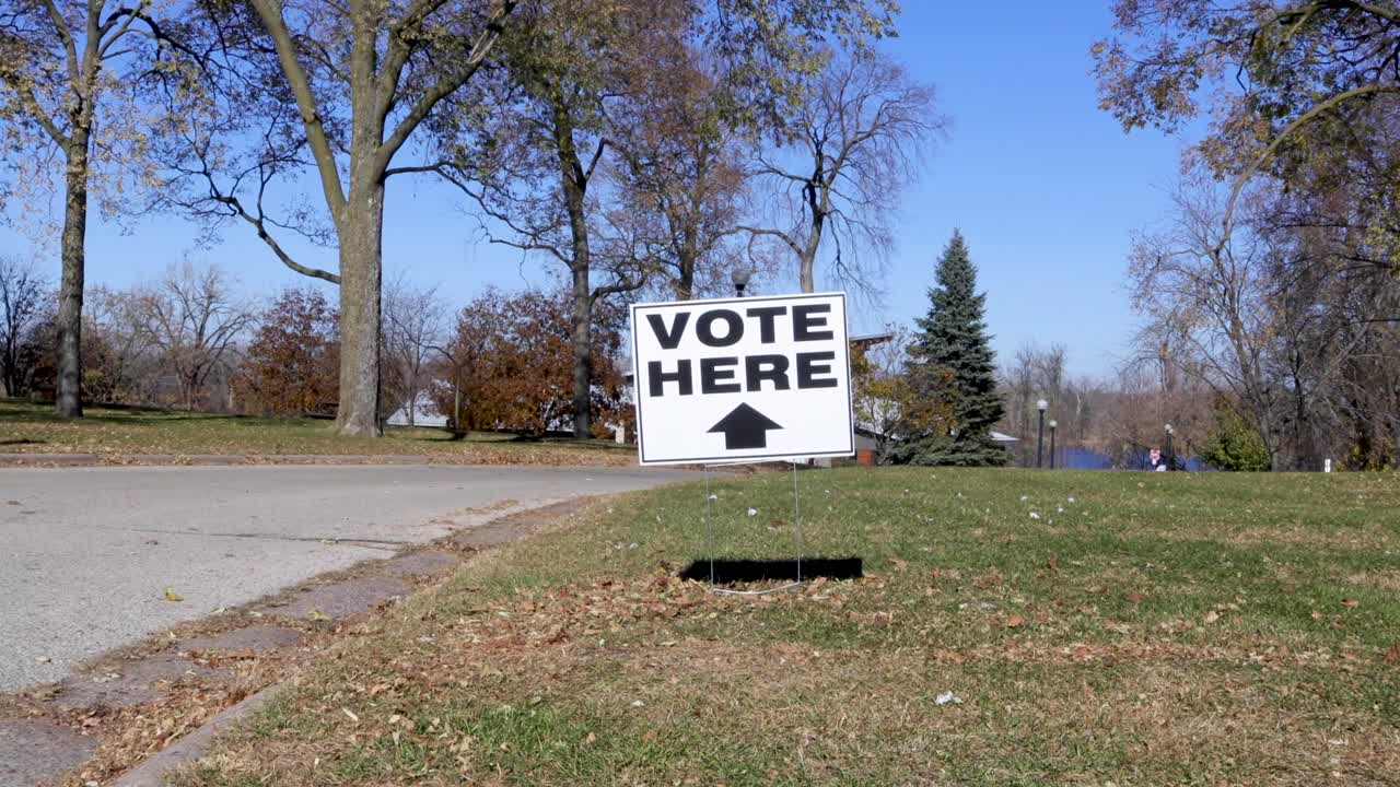 Vote here voting sign on the lawn