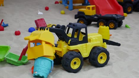 children's toys in a sandbox