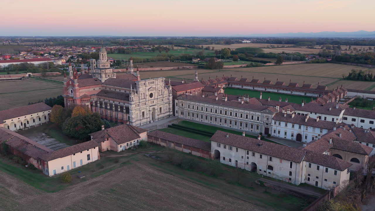 Certosa di Pavia aerial shot at sunset Gra-Car (Gratiarum Carthusia, Monastery of Santa Maria delle Grazie - Sec. XIV),Pavia, Italy