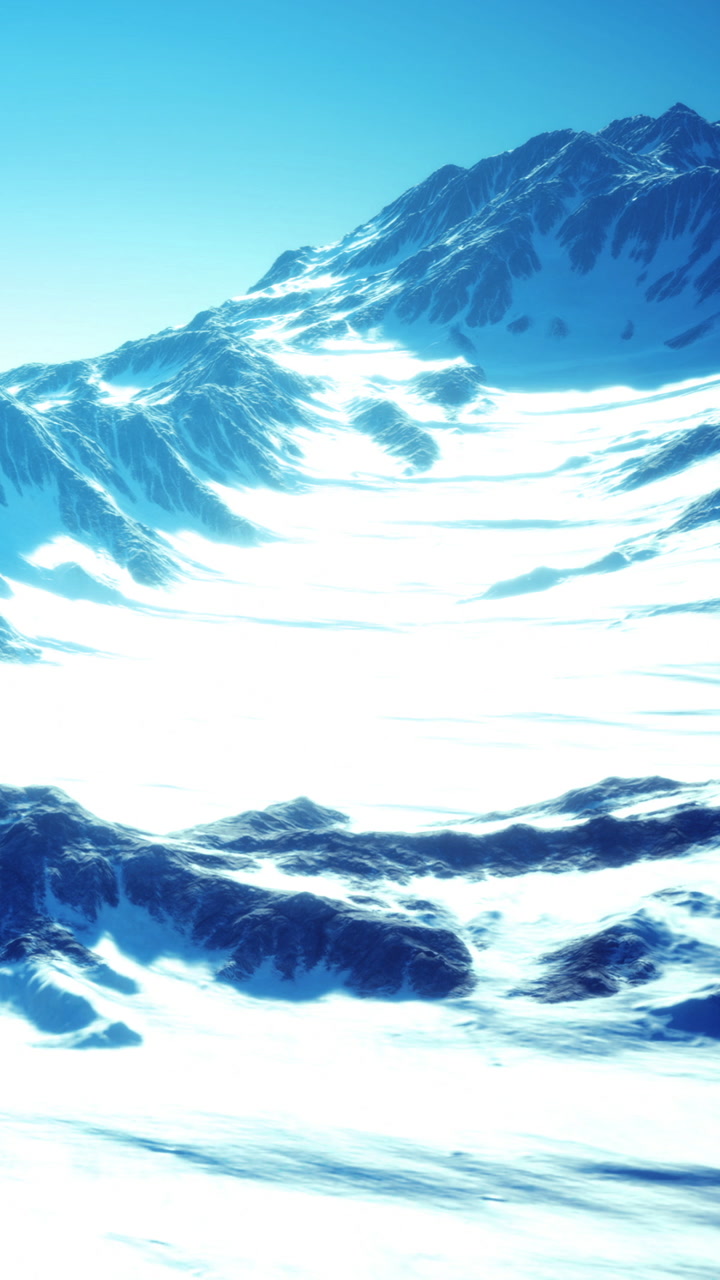 Mountains and ice field at high altitude under clear sky