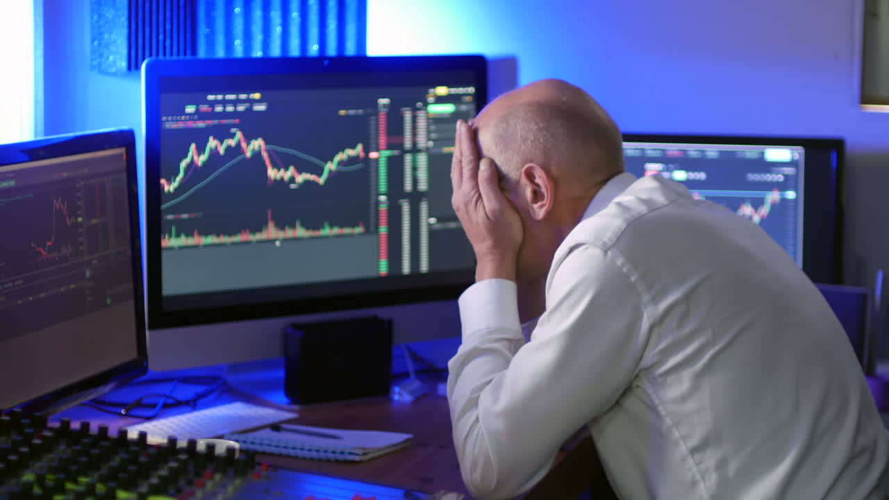 A mature businessman loses money on cryptocurrency trading