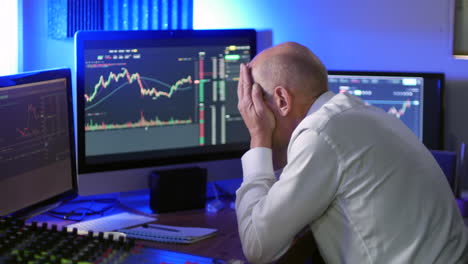 a mature businessman loses money on cryptocurrency trading