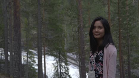 Girl-smiling-in-forest.-slowmotion