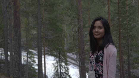 girl smiling in forest. slowmotion