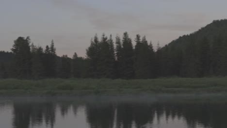 handheld panning shot along the snake river to mountains in western wyoming