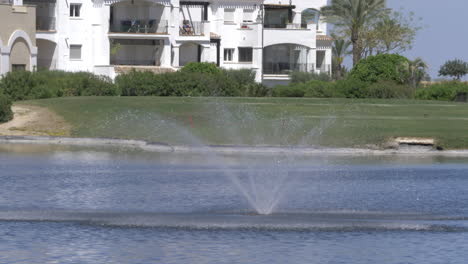 fountain in the middle of a lake in spain