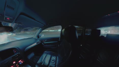 Time-Lapse-Footage-of-Light-Trails-Behind-the-Window-of-a-Driving-Car-at-Night