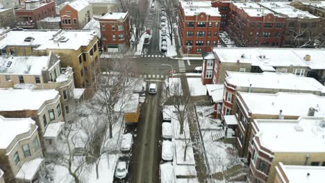 birds eye view of cars driving on urban road during winter