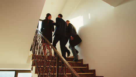 business workers walking up on stairs