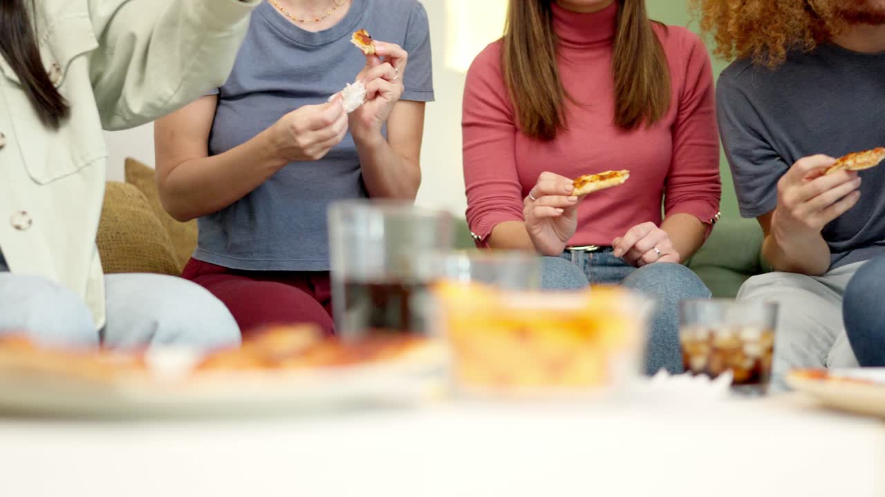 Unrecognizable people eating pizza together at home