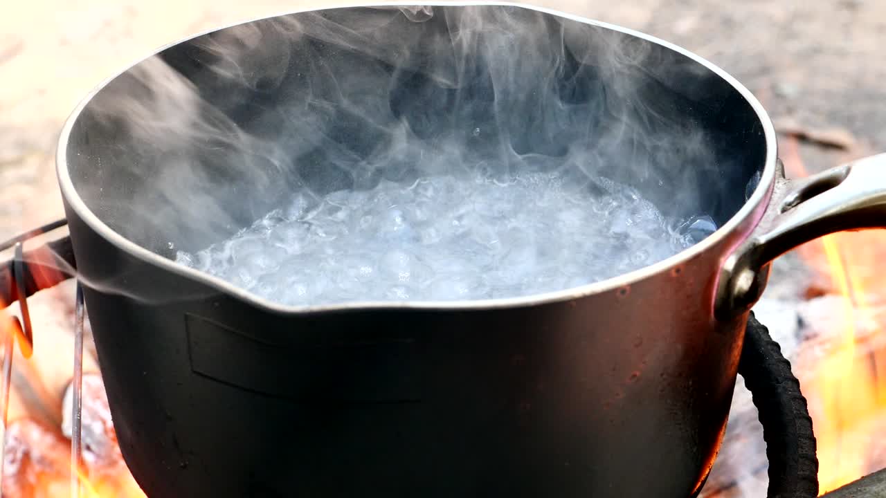 Close up, Water is boiling in a pot.