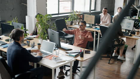 happy employees celebrating success in office