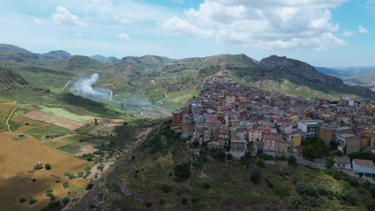 Aerial drone footage of Sant’Angelo Muxaro, Sicily: hilltop village surrounded by valleys and nature, rich in ancient history and rural charm. Perfect for travel, culture, and documentary projects