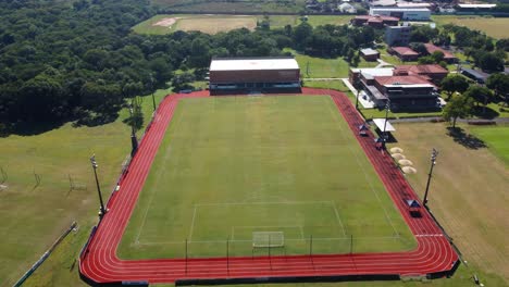 aerial view of unique high performance center, green soccer field, paraguay