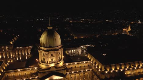 aerial pullback reveals buda castle at night