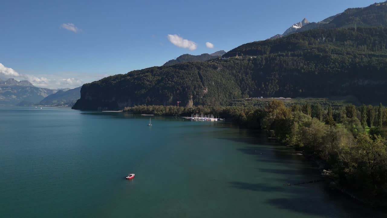 Stunning Aerial View of a Calm Lake Surrounded by Mountains