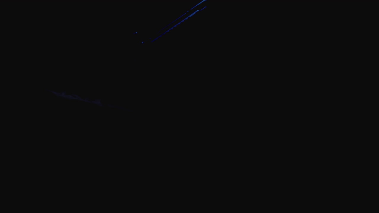 Machineguns on the dark background and in blinking red and blue light are falling in slowmotion