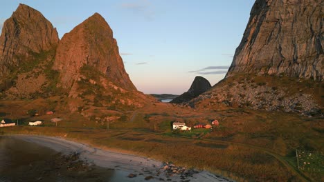 mountain range with a settlement next to the beach