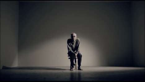 elderly man in a studio setting