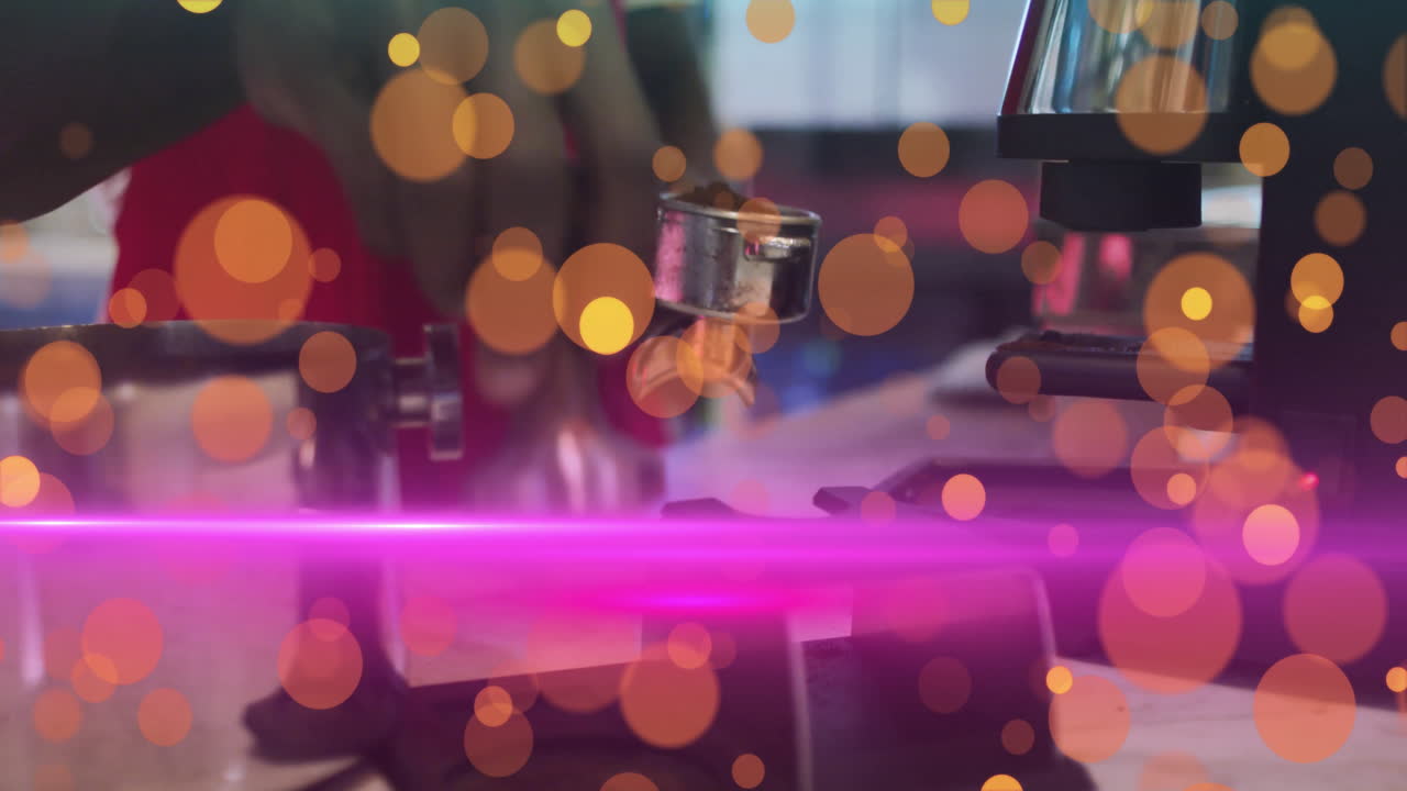 Male barista gripping portafilter at coffee counter, showcasing orange bokeh circles, magenta flare