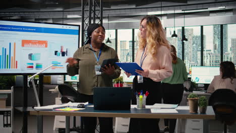 vertical video businesswomen in corporate setting show empowerment through action