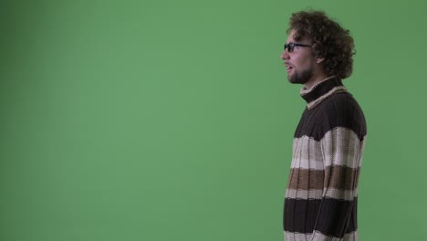 young handsome bearded man with curly hair