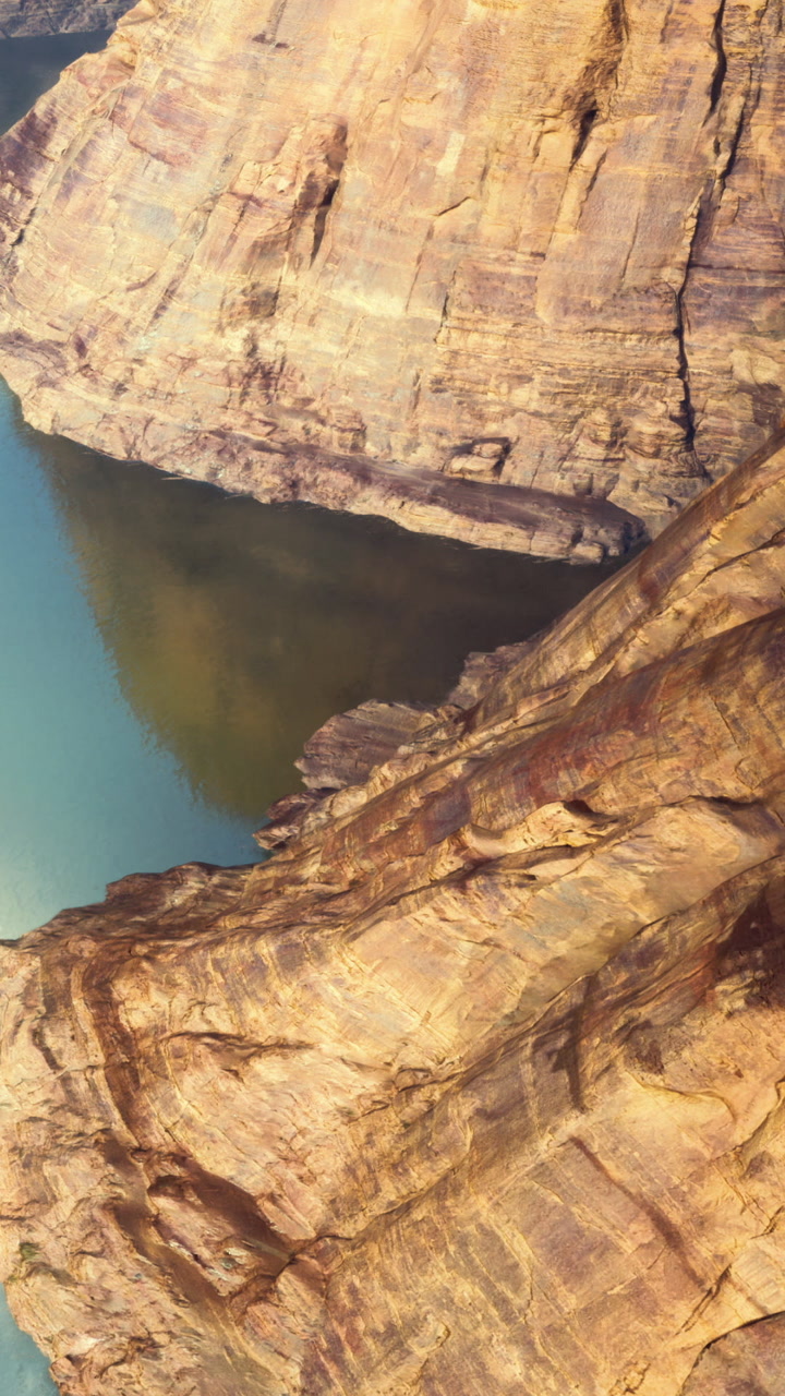 Colorful rock formations along the river bend in the desert landscape