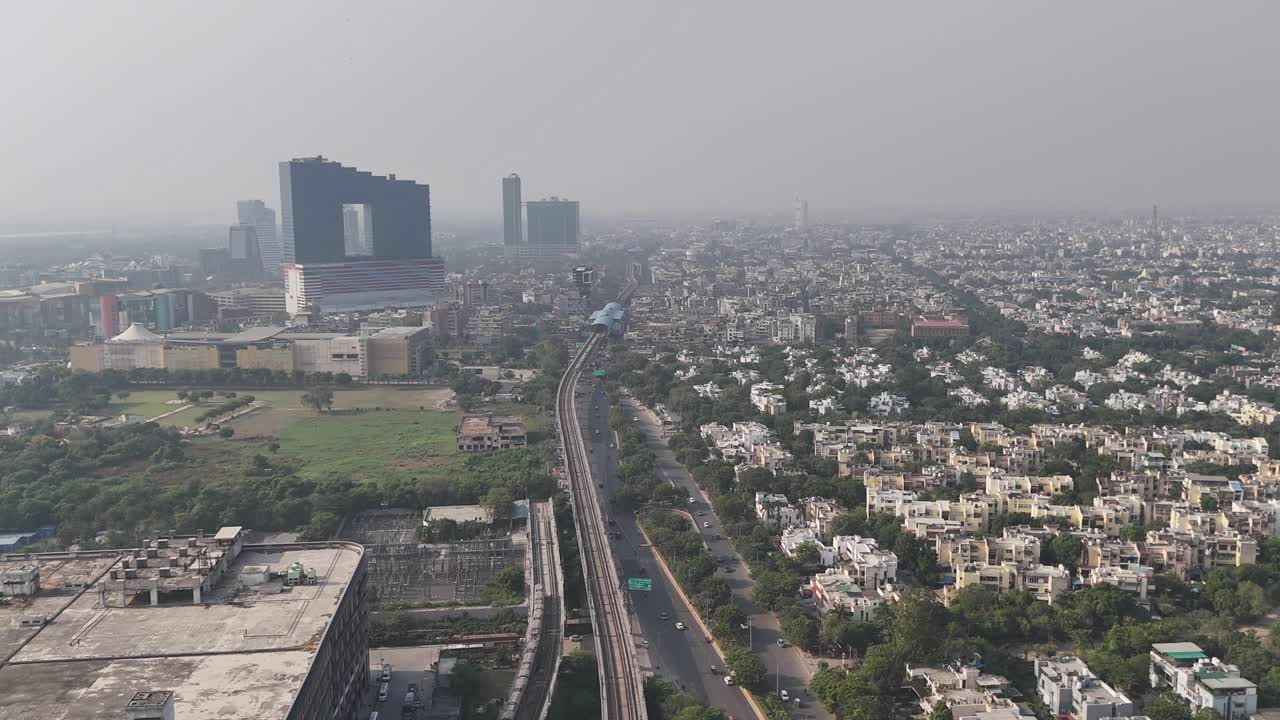 Aerial footage of Noida’s elevated flyovers, green stretches, and apartment blocks capturing the region’s strong infrastructure growth
