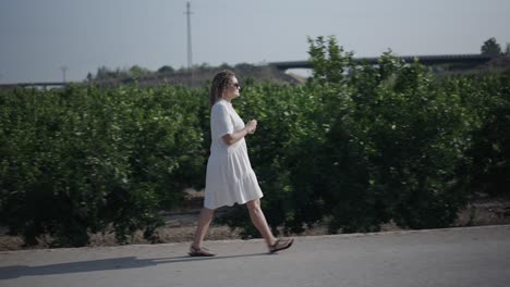 woman walking in an orchard