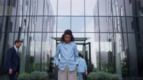 Concerned-executive-manager-reflecting-business-ideas-in-busy-urban-city-center.