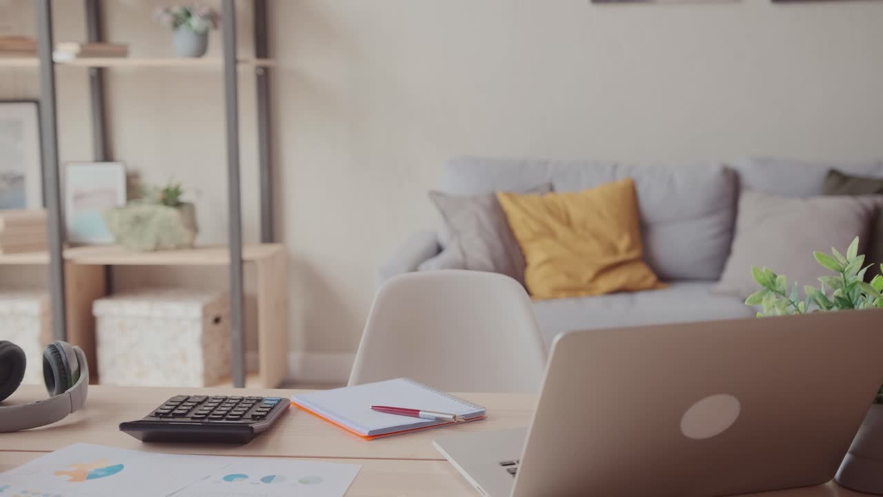 Empty employee desk workplace with computer and documents on it