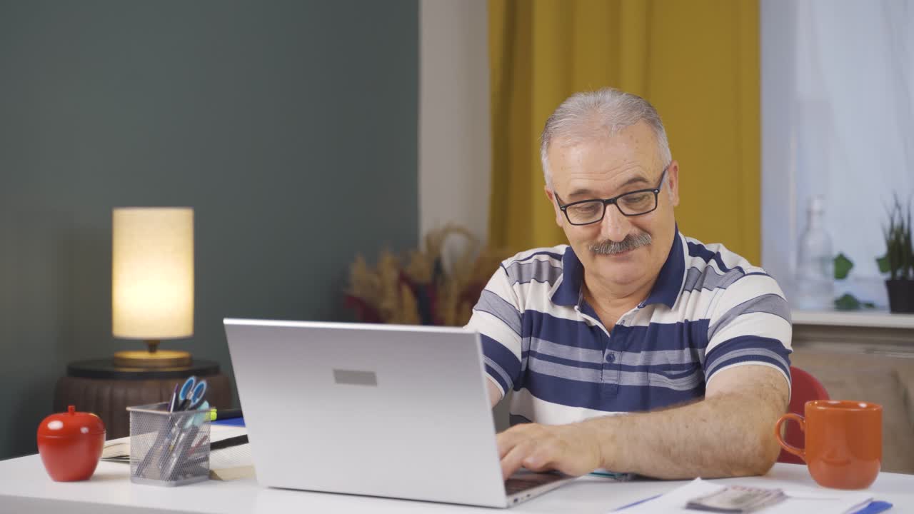 Home office worker old man making money and feeling happy.