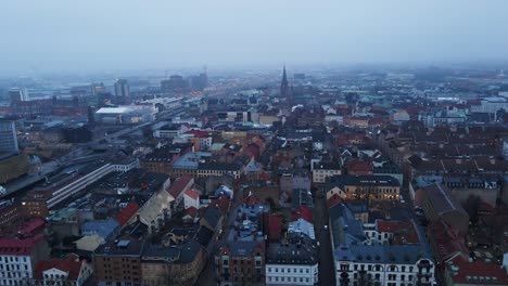 Aerial of the beautiful downtown district of Malmö, Sweden on a misty morning
