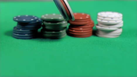 gambling chips falling down in super slow motion