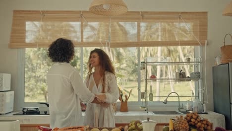 couple in a tropical kitchen